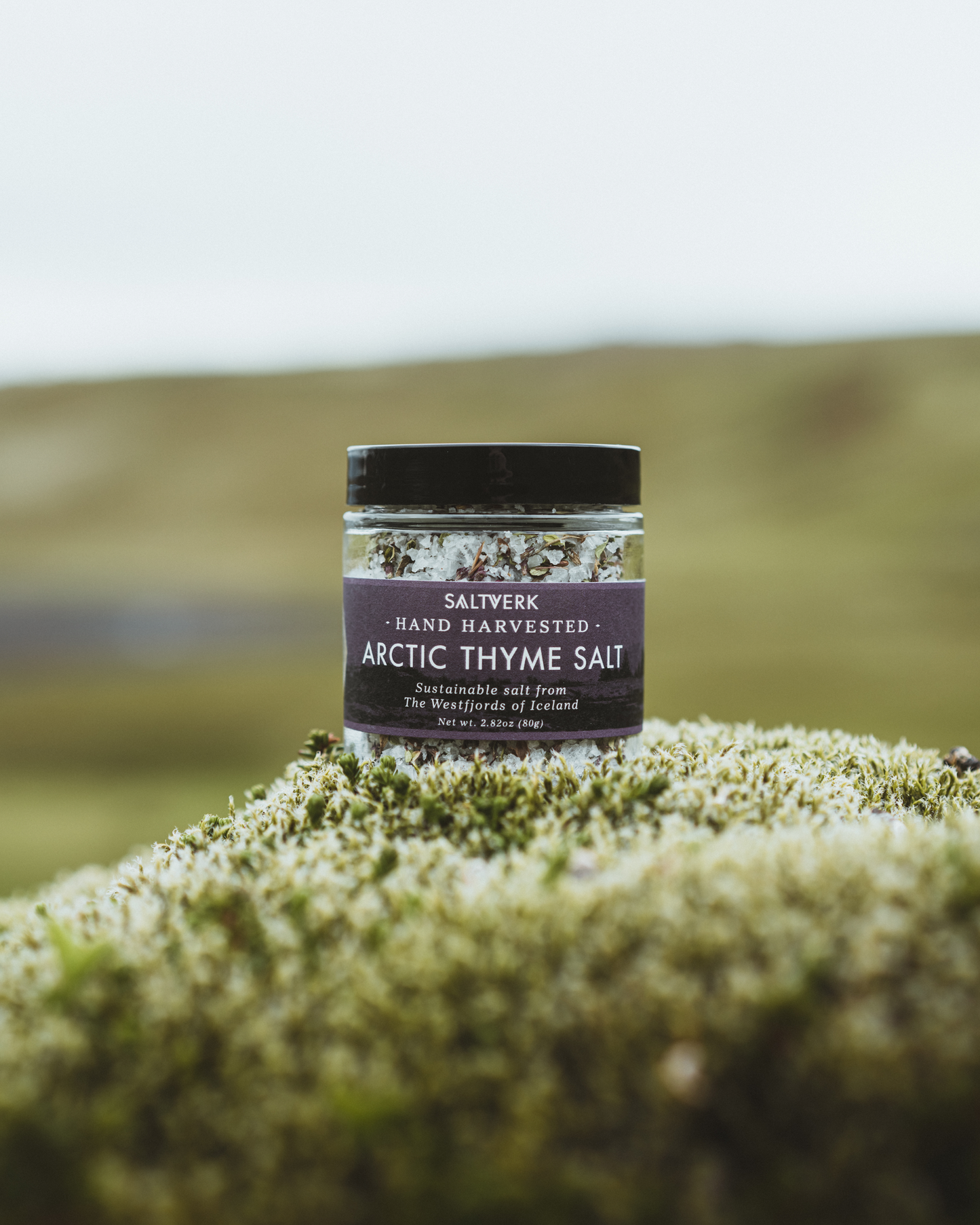 Jar of Arctic Thyme Salt on a mossy background